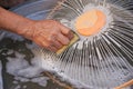 Man hand scrubbing a dirty fan components in the basin with a detergent Royalty Free Stock Photo