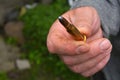 Man hand showing 7.62 caliber ammunition bullet Royalty Free Stock Photo
