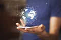 Man hand with smartphone and virtual sphere globe Royalty Free Stock Photo