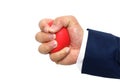 A man hand squeezing a stress ball Royalty Free Stock Photo