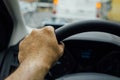 Man hand on steering wheel of a car Royalty Free Stock Photo