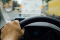 Man hand on steering wheel of a car Royalty Free Stock Photo