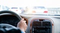 Man hand on steering wheel inside of a car Royalty Free Stock Photo