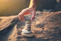 Man hand stone tower on the beach. Royalty Free Stock Photo