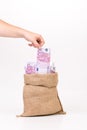 Man hand taking money euro bill from bag. Royalty Free Stock Photo