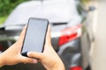 Man Hand Taking Photo Of Car Accident Through Smartphone, close up..Insurance agent using smart phone to take a photo Royalty Free Stock Photo