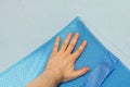 Man hand testing mattress topper Royalty Free Stock Photo