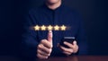 Man hand with thumb up positive emotion smile face icon and five star. Customer review satisfaction feedback survey concept. User Royalty Free Stock Photo