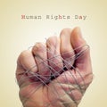 Man hand tied with wire and the text human rights day Royalty Free Stock Photo