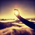 Man hand touch Sun. Misty daybreak in a beautiful hills. Royalty Free Stock Photo