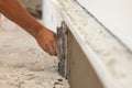 Man hand with trowel plastering a foundation of house Royalty Free Stock Photo