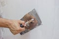 Man hand with trowel plastering a wall Royalty Free Stock Photo