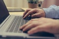 Man hand typing on laptop computer keyboard,close up Royalty Free Stock Photo