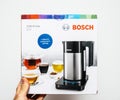 Man hand unboxing unpacking Bosch TWK7203 kettle