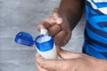 man hand use white petroleum jelly on blue background