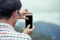 Man hand using cellphone,smartphone,phone to take photo Royalty Free Stock Photo