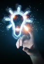Man hand using lightbulb neon digital interface 3D rendering