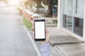 Man hand using mobile smart phone with blank white screen. blurred background