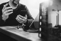 man hand using VOIP headset with digital tablet computer docking