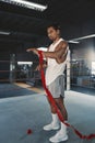 Man With Hand Wrap On Boxing Ring. Portrait Of Sportsman With Muscular Body Using Wrist Bandage For Training At Gym.