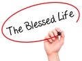 Man Hand writing The Blessed Life with black marker on visual s