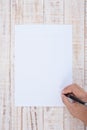 Man hand writing Paper on wood table for text and background Royalty Free Stock Photo