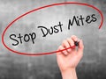 Man Hand writing Stop Dust Mites with black marker on visual sc Royalty Free Stock Photo