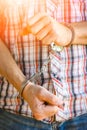 Man handcuffed outdoors in the park