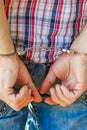 Man handcuffed outdoors in the park