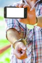 Man handcuffed outdoors in the park