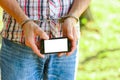 Man handcuffed outdoors in the park