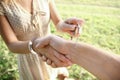 man handcuffed outdoors in the park