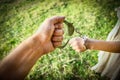 man handcuffed outdoors in the park