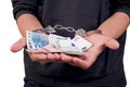 Man in handcuffs holding money Royalty Free Stock Photo