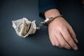 Man handcuffs with money Royalty Free Stock Photo