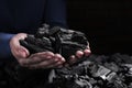 Man with handful of coal, closeup view Royalty Free Stock Photo