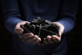 Man with handful of coal, closeup view Royalty Free Stock Photo