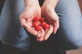 Man with handful of tomatoes