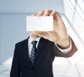 Man handing a blank business card Royalty Free Stock Photo