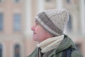 Man in handmade knitted winter beanie hats form natural lamb wool with cable pattern