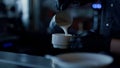 Man hands adding cream to coffee closeup. Bartender making cappuccino