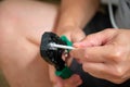 Man hands attaching net cable to RJ45 connector using data cable crimper. Royalty Free Stock Photo