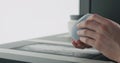 Man hands check bottom of blue ceramic bowl