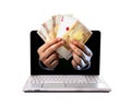 Man hands comming outlaptop holding euro banknotes and ace poker playing cards Royalty Free Stock Photo