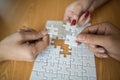 Man hands connecting couple puzzle piece in office. Business solutions, target, successful, goals and strategy Royalty Free Stock Photo