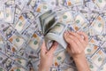 Man hands counting 100 dollar bills. In the hands of a lot of cash Royalty Free Stock Photo