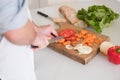 Man hands cutting vegetables in the kitchen Royalty Free Stock Photo