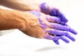 Man hands dirty by purple paint as decoration, housework, painter, color bright background concept