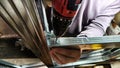 Man hands drilling metal planc in construction. Building iron fence with a drill and screw. Close up of his hand and the Royalty Free Stock Photo