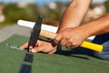 Man hands fastening bitumen roof shingles Royalty Free Stock Photo